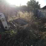 bobcat hire Elizabeth clearing overgrown yard at investment property